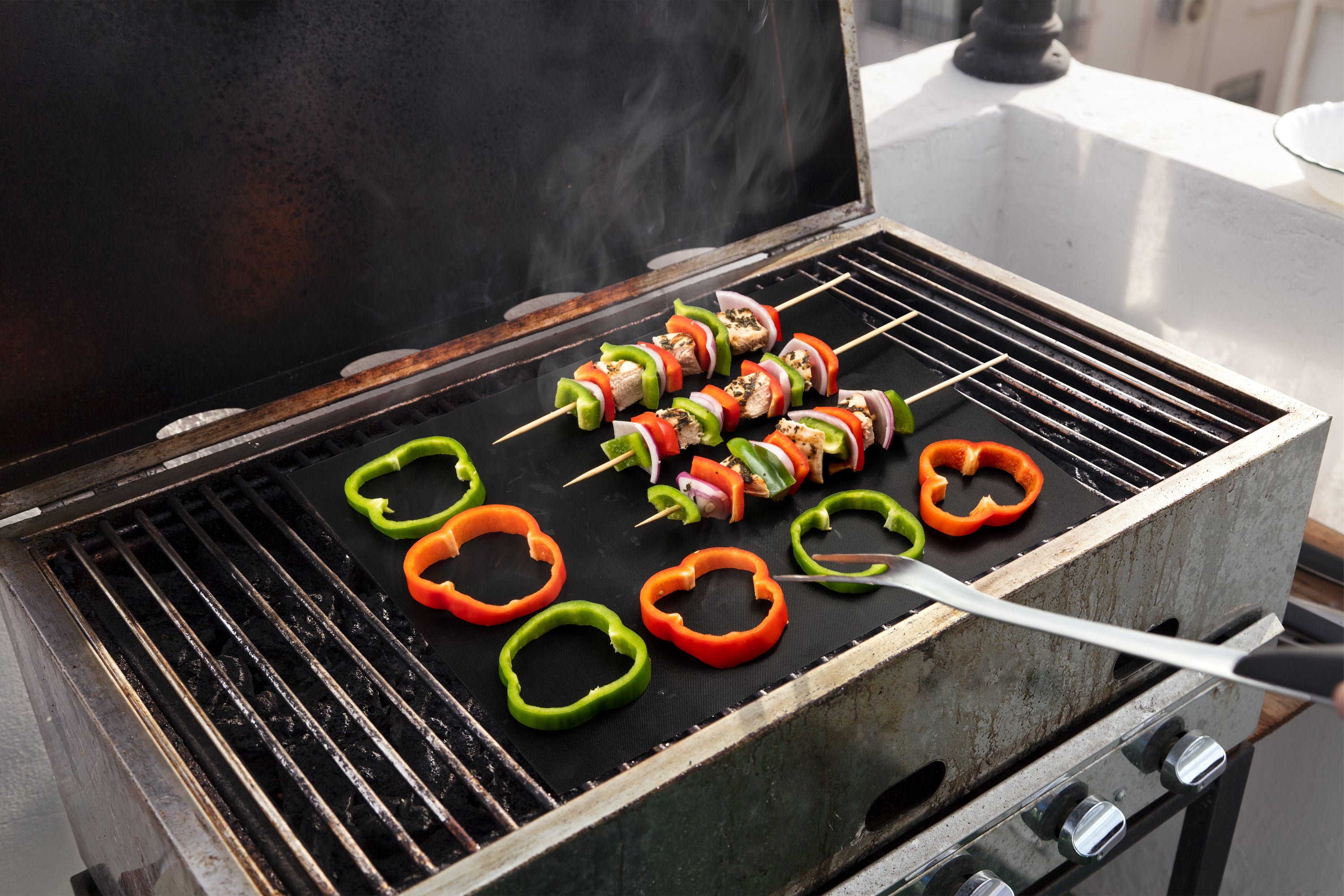 Set de tapetes protectores para asador